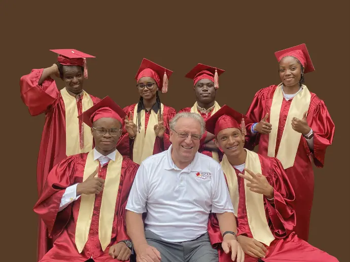 U-Can School Director with graduands celebrating the Canadian OSSD pathway